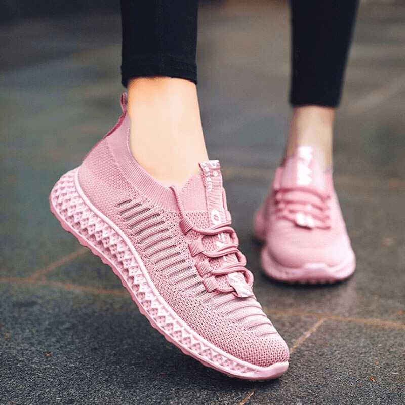 Pink lace-up mesh breathable women's sneakers, perfect for casual wear and comfort with flat bottoms.